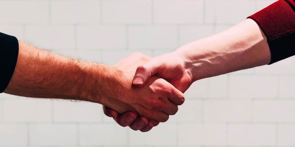 Two people shaking hands